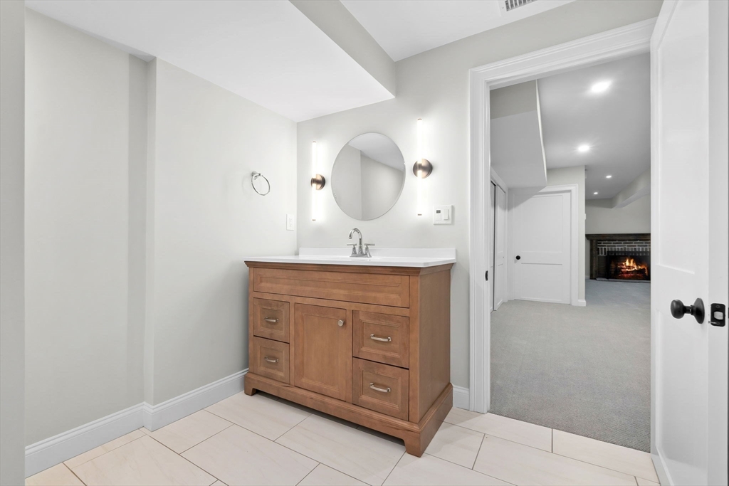 111 Killam Hill Road Boxford, MA 01921 - Photo 34 of 42 a bathroom with a sink vanity and a mirror