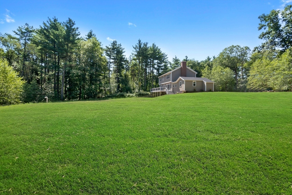 111 Killam Hill Road Boxford, MA 01921 - Photo 42 of 42 a front view of a house with a yard and trees