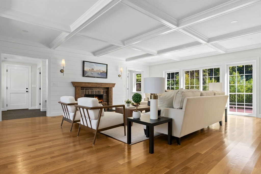 111 Killam Hill Road Boxford, MA 01921 - Photo 5 of 42 a living room with furniture a fireplace and wooden floor