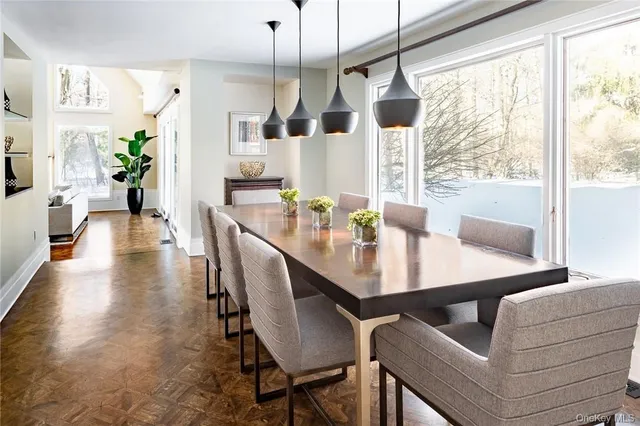 a dining room with furniture and window