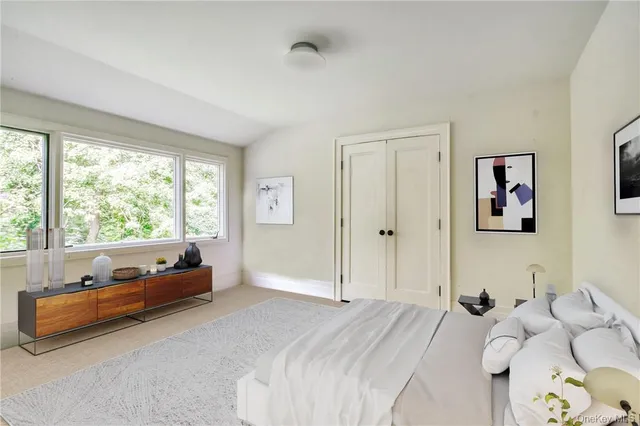 a bed room with a bed and a couch