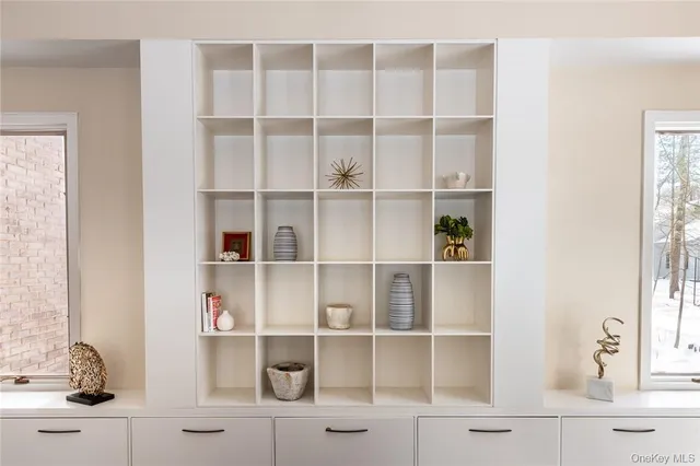 a view of a kitchen with wooden floor and cabinets