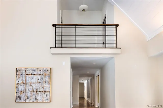 a view of a hallway with windows