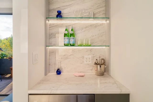 a bathroom with a sink mirror and vanity