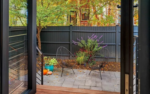 a view of a chairs and table in a window