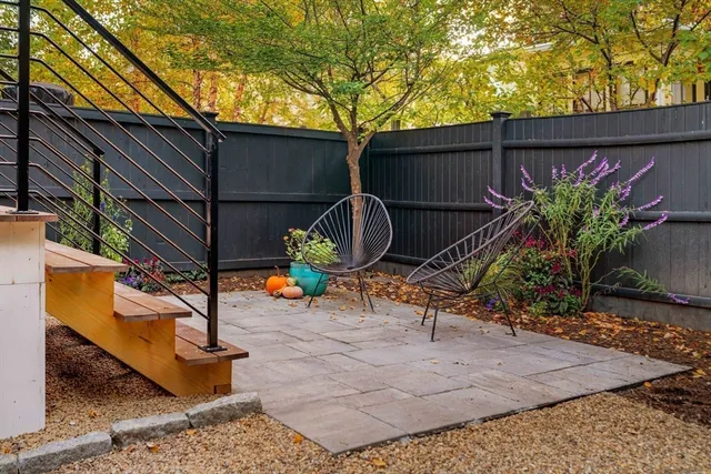 a backyard of a house with sitting area