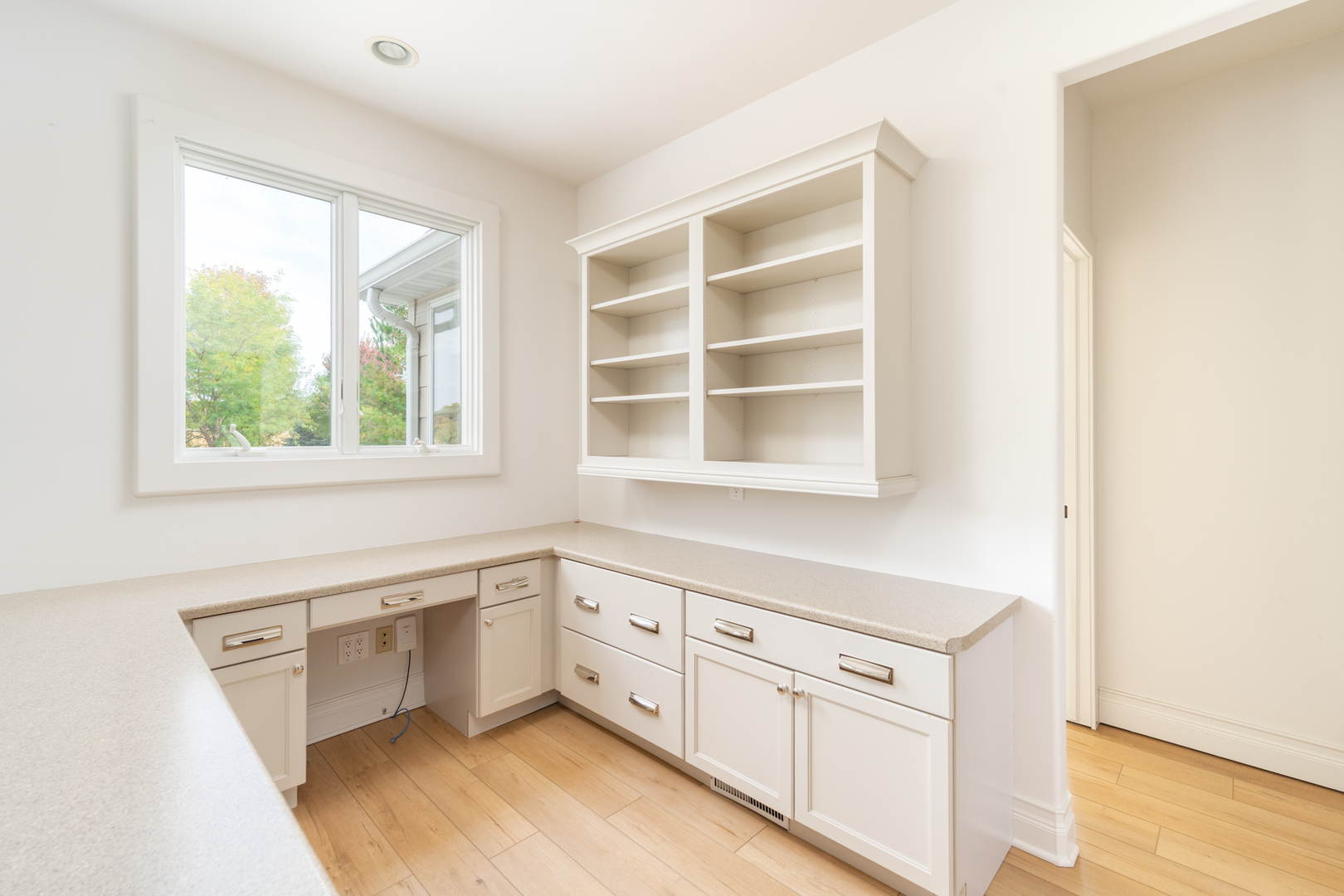 2138 East 550th Road Oglesby, IL 61348 - Photo 18 of 50 a kitchen with white cabinets and a window