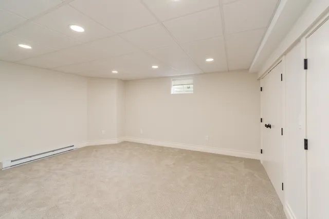 an empty room with a empty space and windows