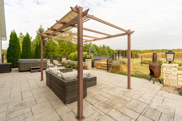 a view of a lounge chairs in the back yard of the house