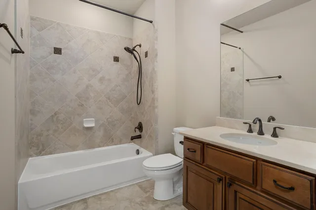 a bathroom with a sink a toilet and a bathtub