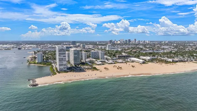 a view of city with ocean