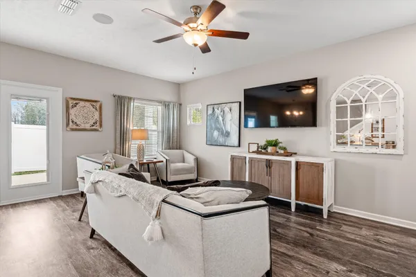 a living room with furniture and a flat screen tv