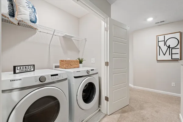 a view of entryway with washer and dryer