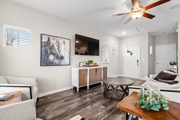 a living room with furniture and a flat screen tv