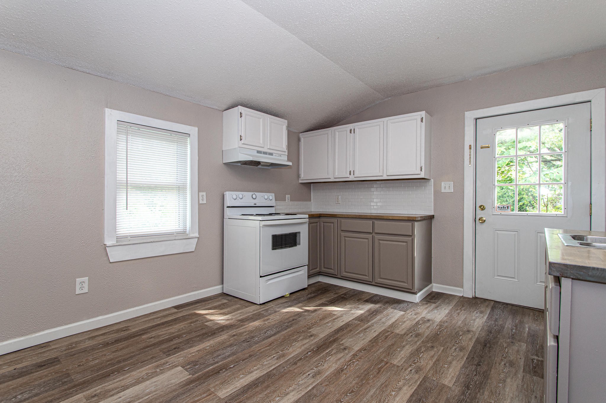 615 Butler Mill Road Oliver Springs, TN 37840 - Photo 12 of 35 a kitchen with a stove a sink and a window