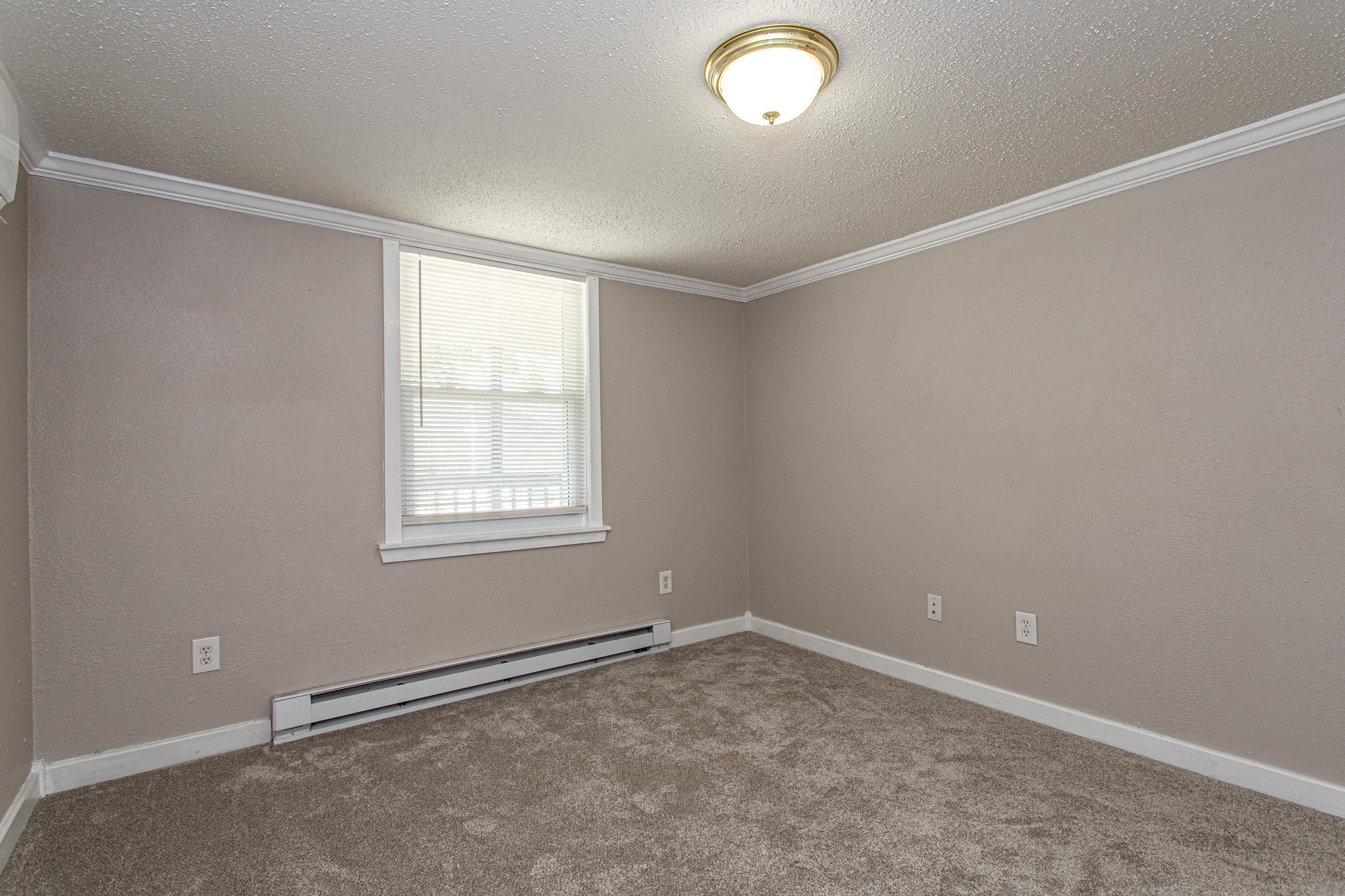 615 Butler Mill Road Oliver Springs, TN 37840 - Photo 18 of 35 an empty room with a empty space and a window
