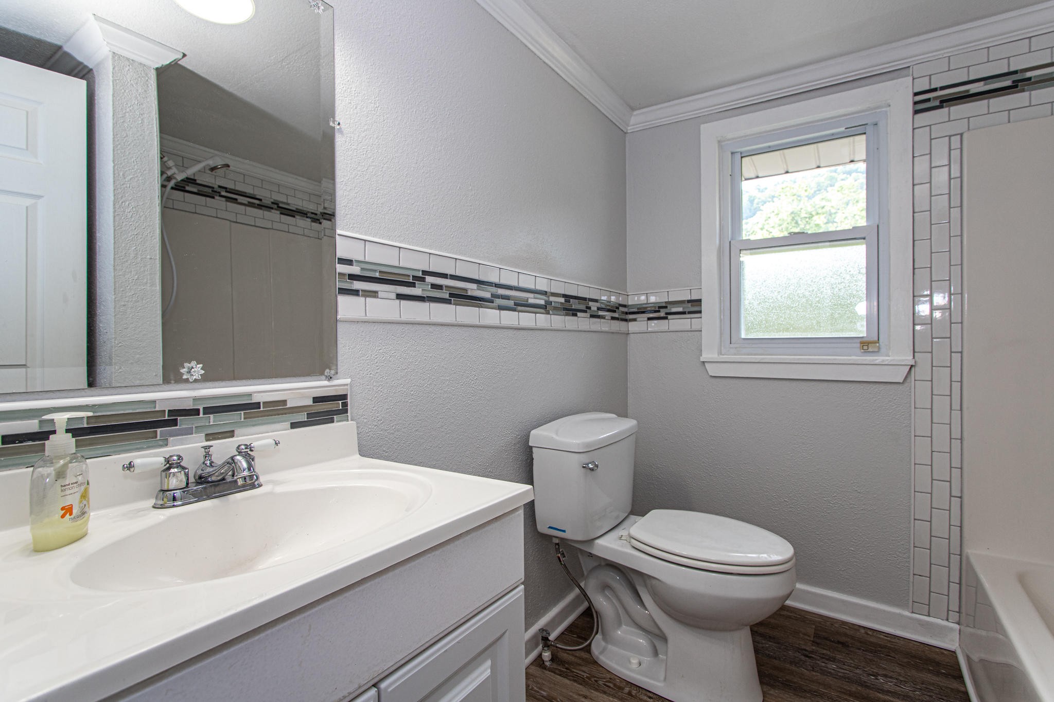 615 Butler Mill Road Oliver Springs, TN 37840 - Photo 29 of 35 a bathroom with a sink a toilet and tub
