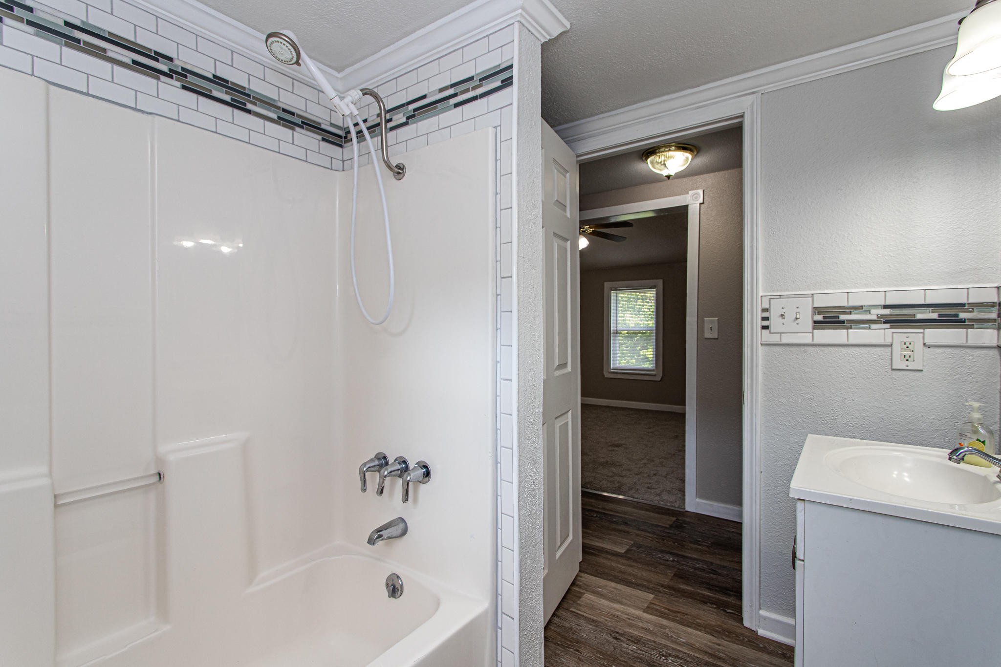615 Butler Mill Road Oliver Springs, TN 37840 - Photo 30 of 35 a bathroom with a tub and shower
