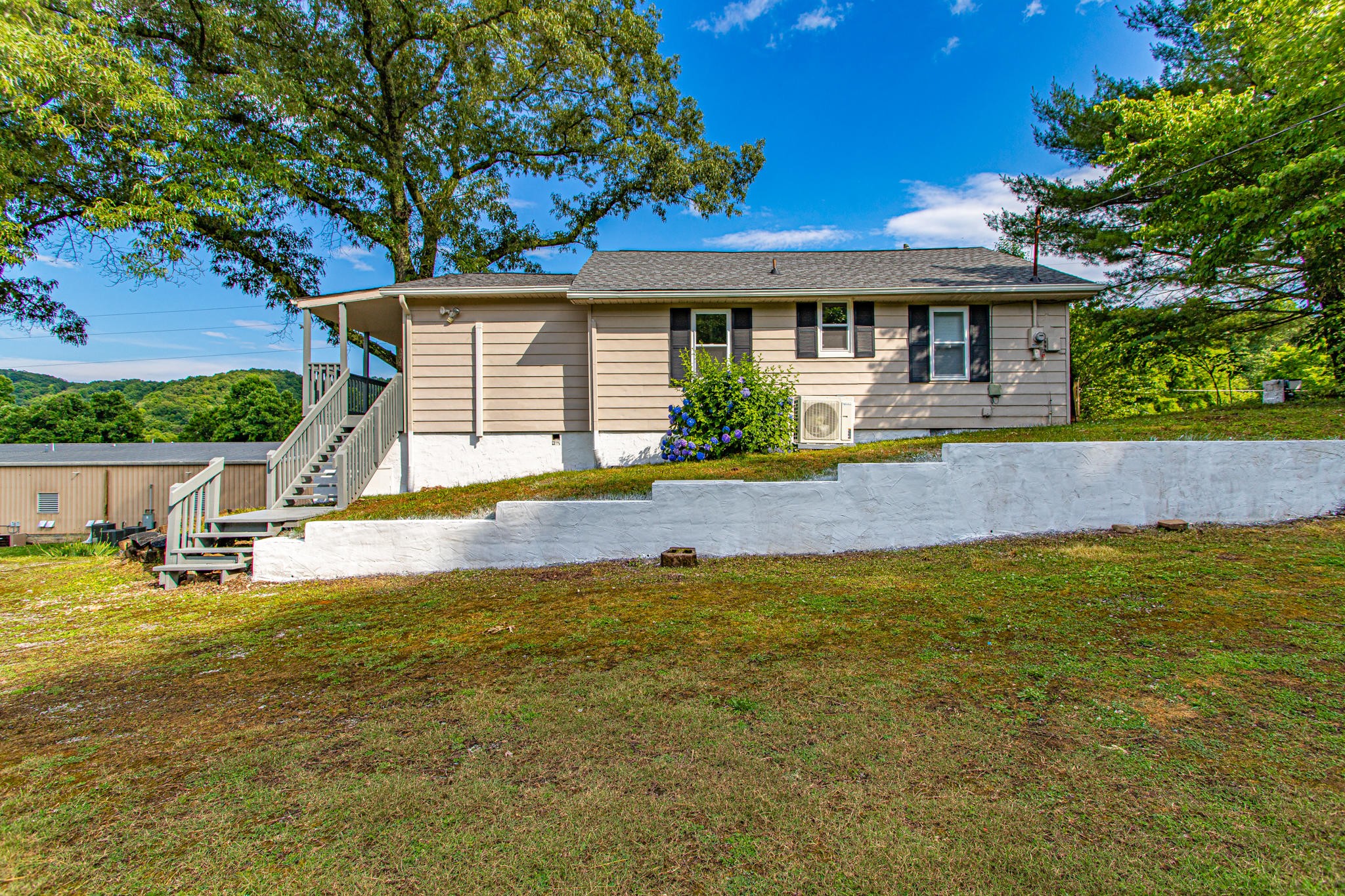 615 Butler Mill Road Oliver Springs, TN 37840 - Photo 3 of 35 a front view of house with yard patio and swimming pool