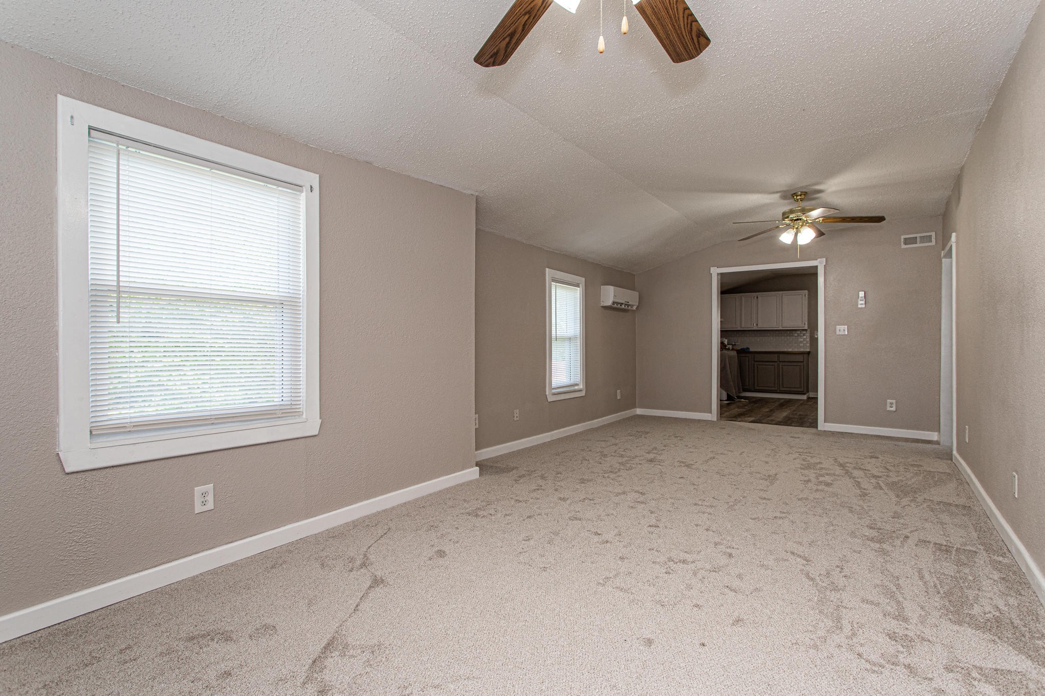 615 Butler Mill Road Oliver Springs, TN 37840 - Photo 6 of 35 an empty room with chandelier fan and windows