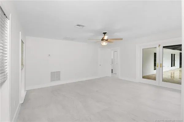 a large bathroom with a double vanity sink and a mirror