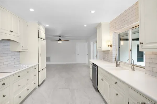 a kitchen with a sink and a window