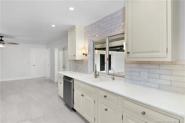 a bathroom with a sink and mirror