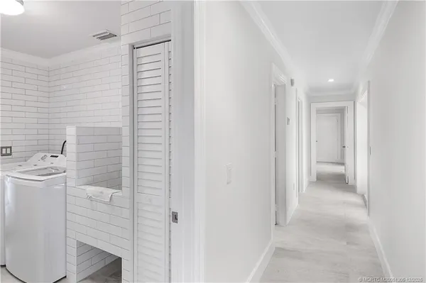 a bathroom with a granite countertop toilet sink and mirror