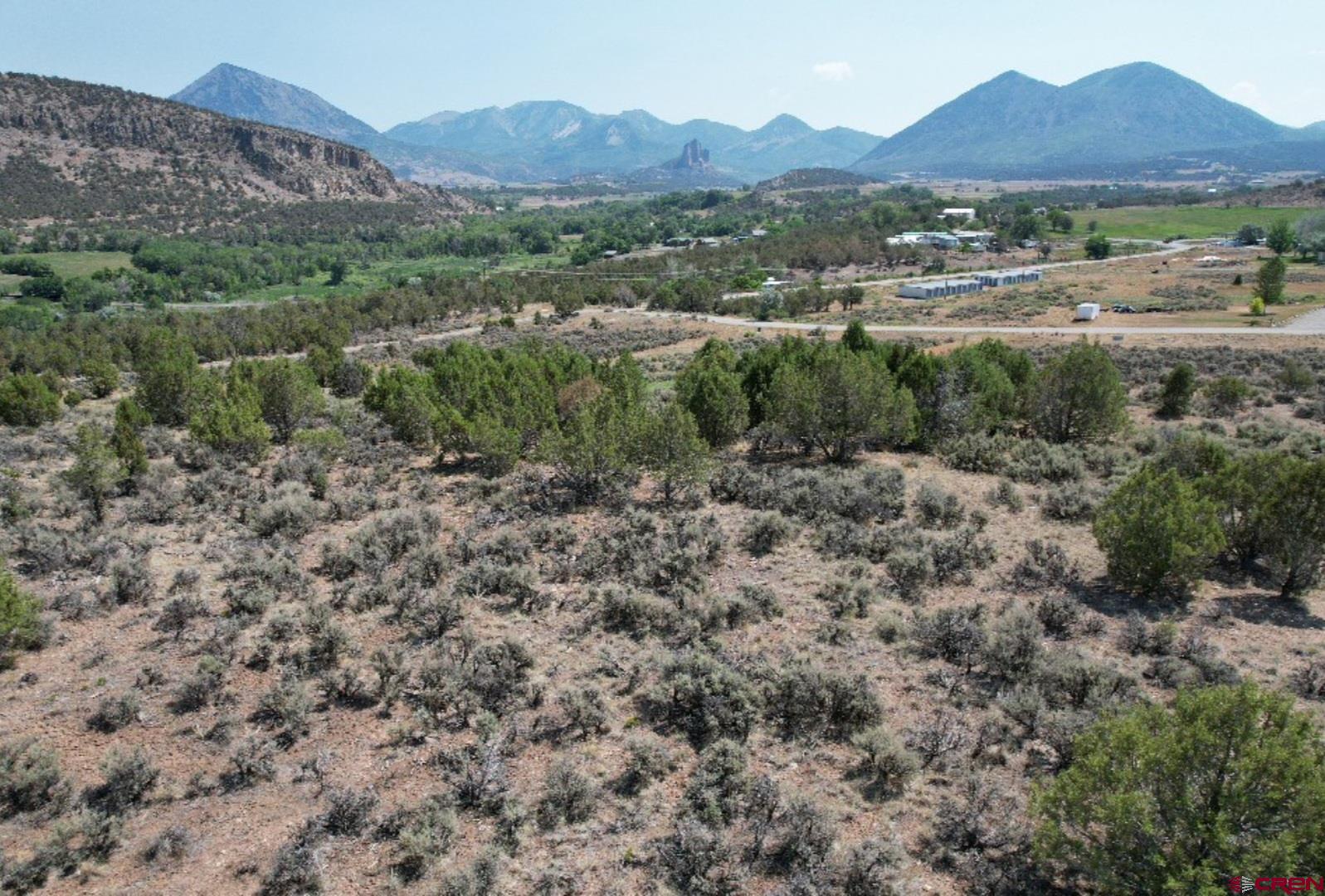 Lot 8 D Road Crawford, CO 81415 - Photo 3 of 18 a view of a town with mountains in the background