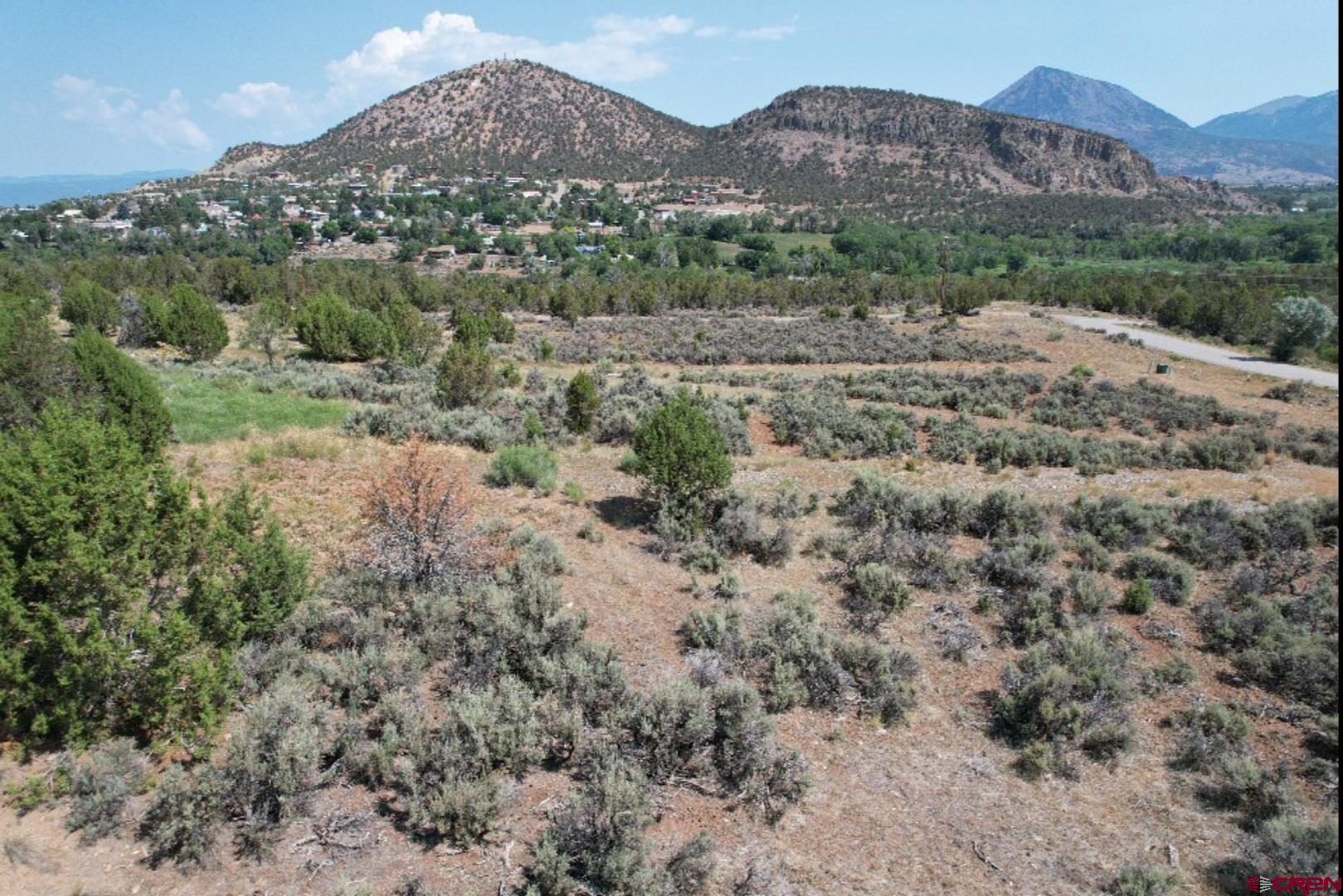 Lot 8 D Road Crawford, CO 81415 - Photo 6 of 18 an aerial view of mountain with trees in the background