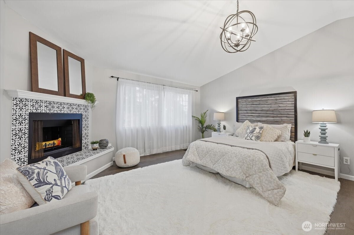 13802 60th Avenue West Edmonds, WA 98026 - Photo 20 of 36 a bedroom with bed and a fireplace