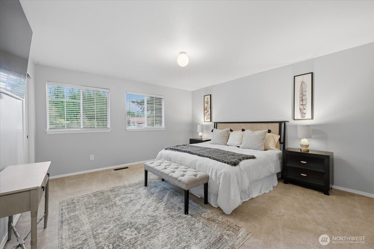13802 60th Avenue West Edmonds, WA 98026 - Photo 24 of 36 a bedroom with a bed and a window