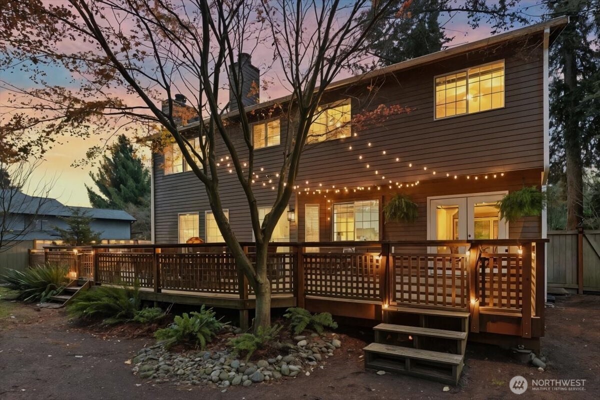 13802 60th Avenue West Edmonds, WA 98026 - Photo 29 of 36 a view of a house with a bench next to a yard