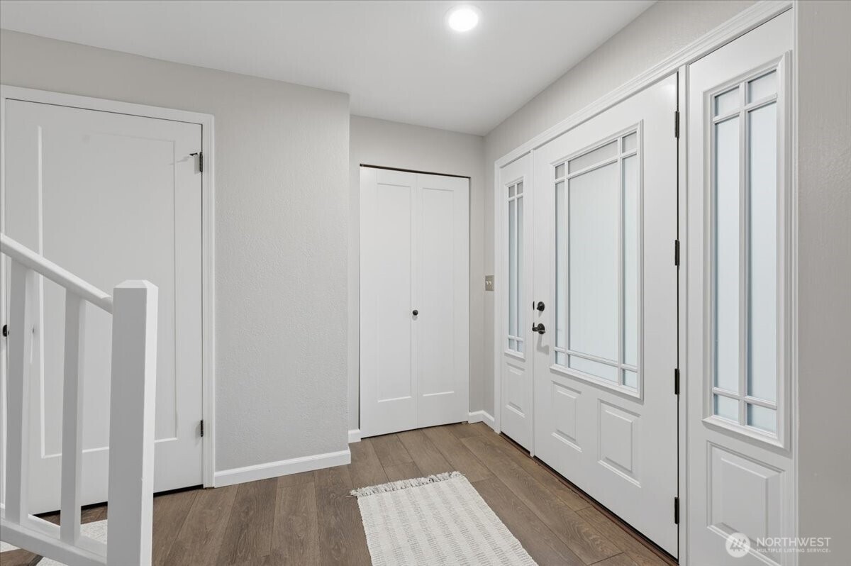 13802 60th Avenue West Edmonds, WA 98026 - Photo 6 of 36 a view of a hallway with wooden floor