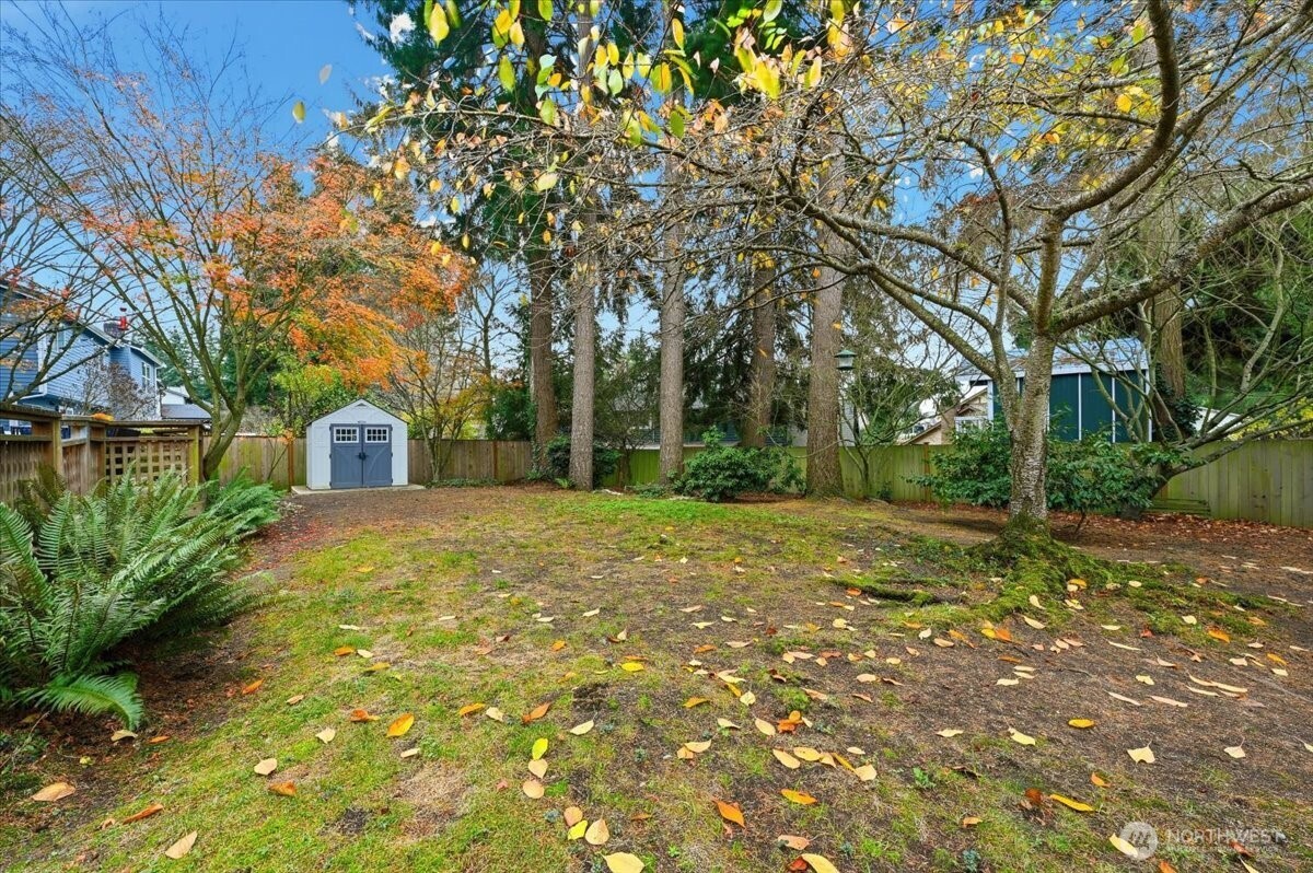13802 60th Avenue West Edmonds, WA 98026 - Photo 9 of 36 a yellow house with trees in front of it