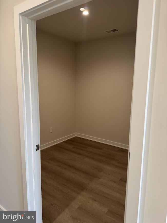 26 South York Road, Unit 103 Hatboro, PA 19040 - Photo 4 of 49 a view of an empty room with wooden floor