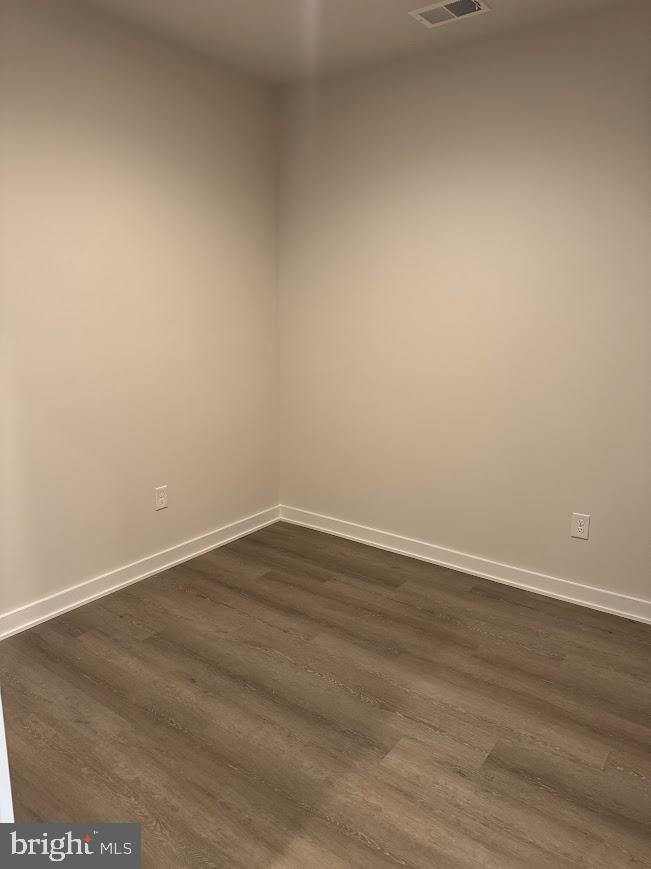 26 South York Road, Unit 103 Hatboro, PA 19040 - Photo 5 of 49 a view of an empty room with wooden floor