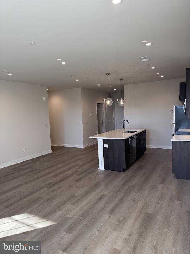 26 South York Road, Unit 103 Hatboro, PA 19040 - Photo 8 of 49 a view of a big room with wooden floor and windows