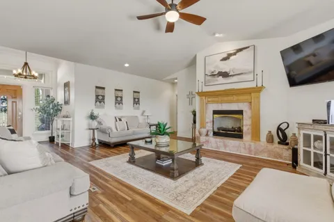 a living room with furniture and a fireplace