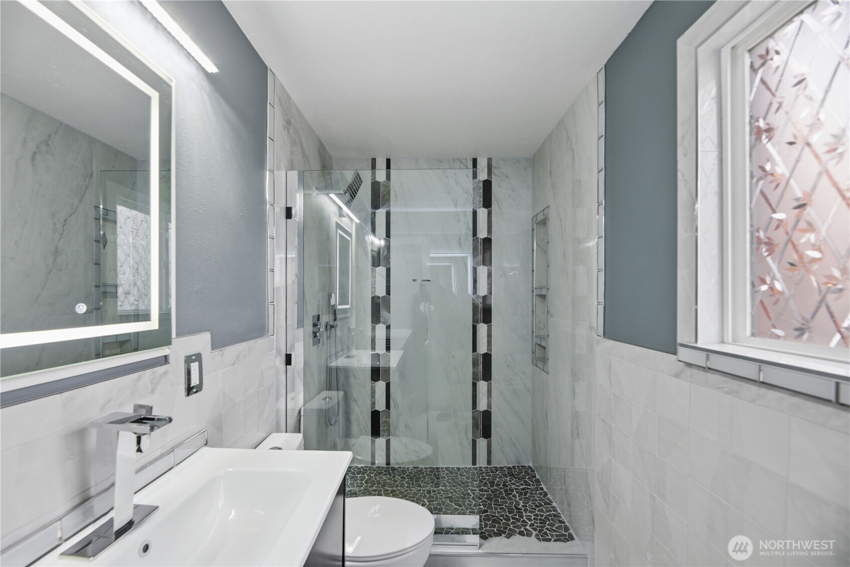 748 South Cloverdale Street, Unit 8 Seattle, WA 98108 - Photo 20 of 30 a bathroom with a toilet a sink and shower