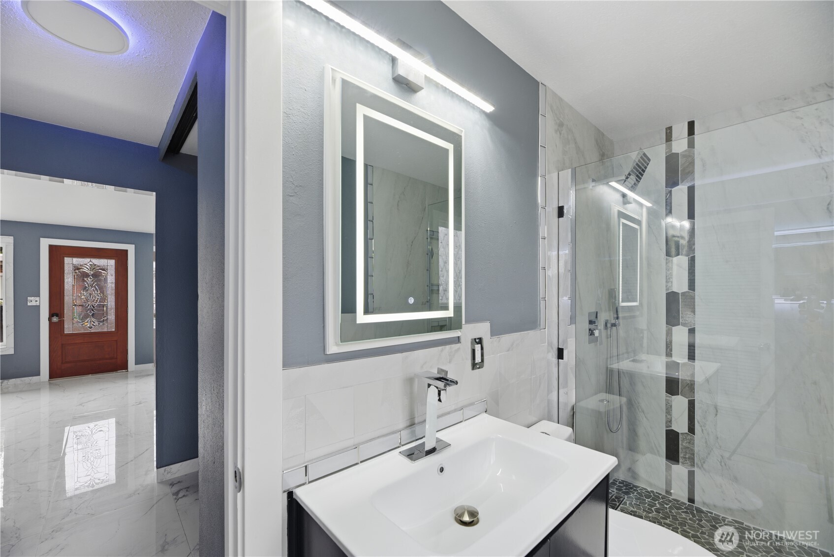 748 South Cloverdale Street, Unit 8 Seattle, WA 98108 - Photo 21 of 30 a bathroom with a sink a toilet and shower