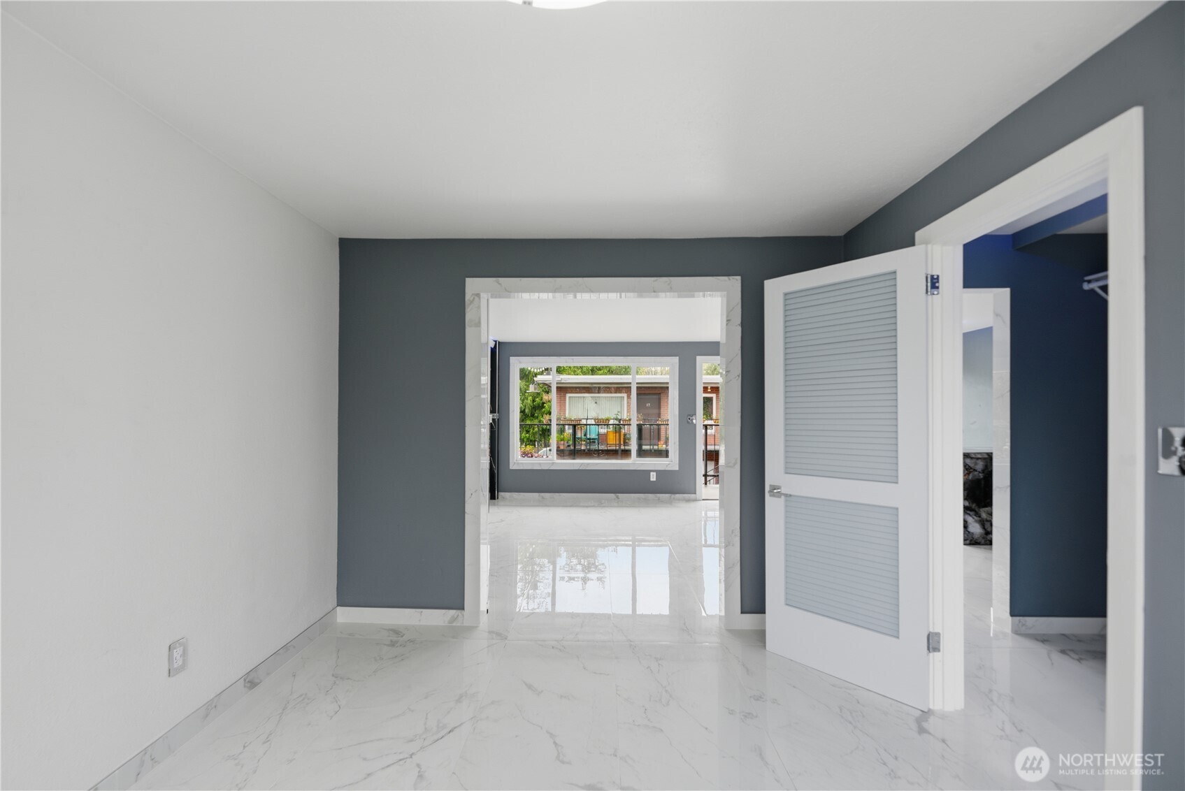 748 South Cloverdale Street, Unit 8 Seattle, WA 98108 - Photo 7 of 30 an empty room with windows