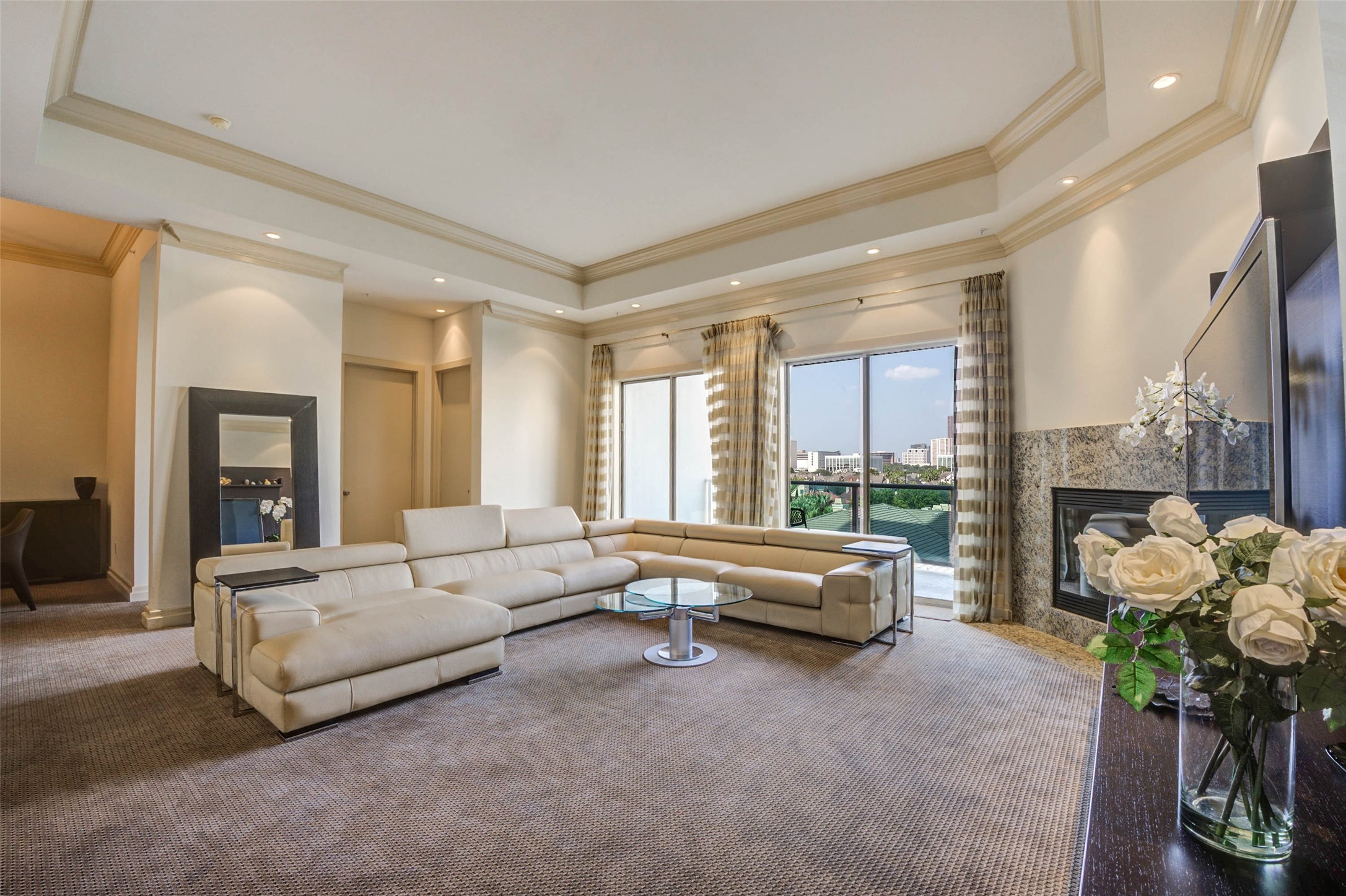 Spacious light and bright living area - which opens up to the 5th floor balcony overlooking the Galleria area.