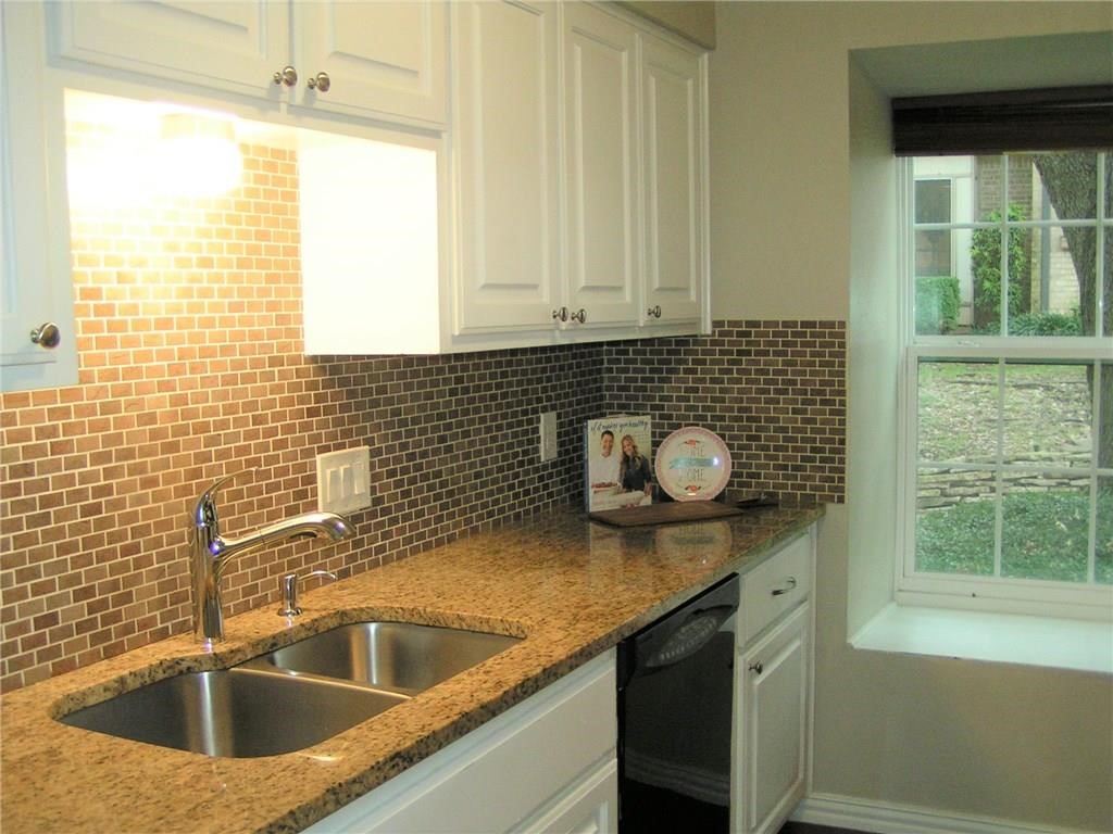 6627 Valleyside Road Austin, TX 78731 - Photo 16 of 32 a kitchen with a sink and a window