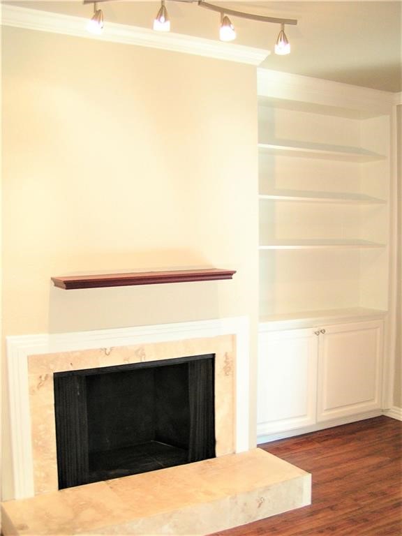 6627 Valleyside Road Austin, TX 78731 - Photo 4 of 32 a living room with a fireplace and a walk in closet