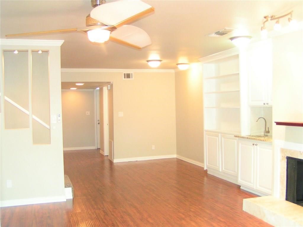 6627 Valleyside Road Austin, TX 78731 - Photo 8 of 32 a view of a hallway with wooden floor
