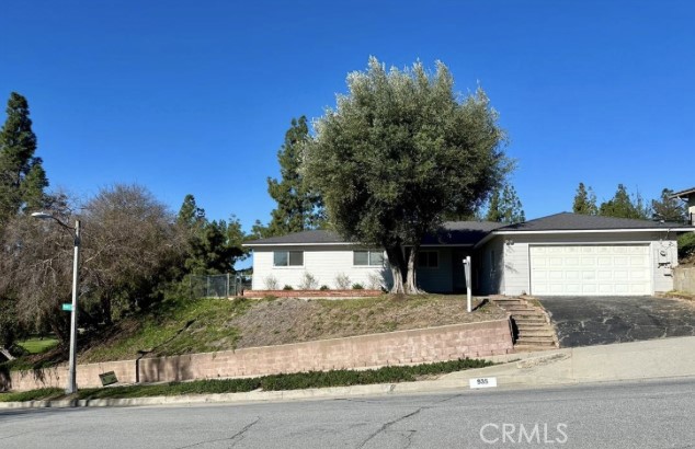 a house with trees in the background