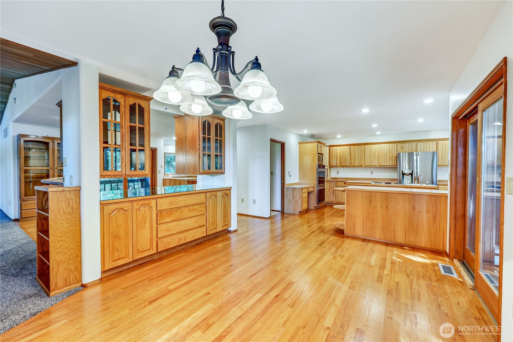 11 Bishop Hill Road Chimacum, WA 98325 - Photo 11 of 34 a view of large kitchen with stainless steel appliances wooden floor and center island