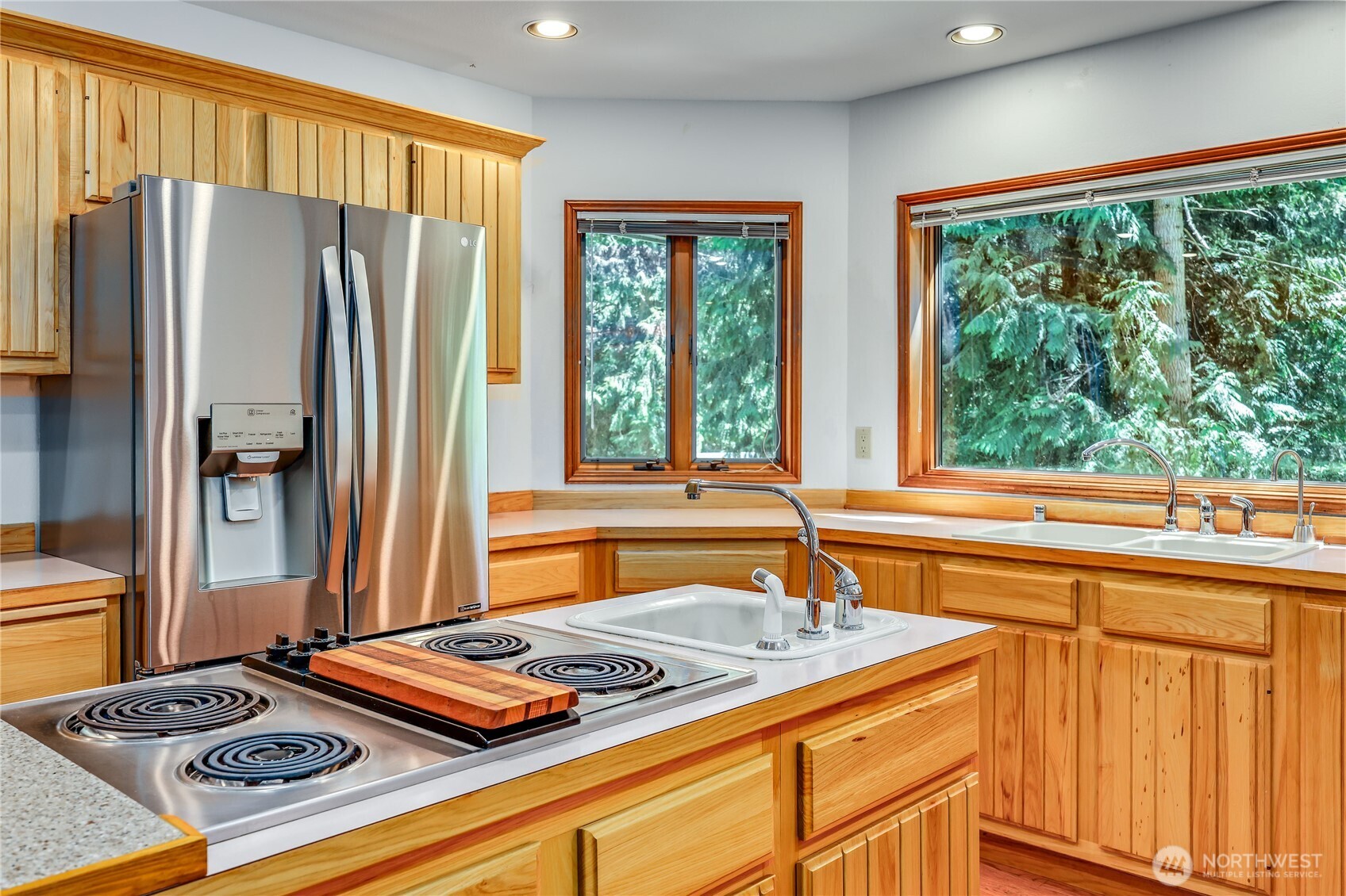 11 Bishop Hill Road Chimacum, WA 98325 - Photo 13 of 34 a kitchen with stainless steel appliances granite countertop a refrigerator and a sink