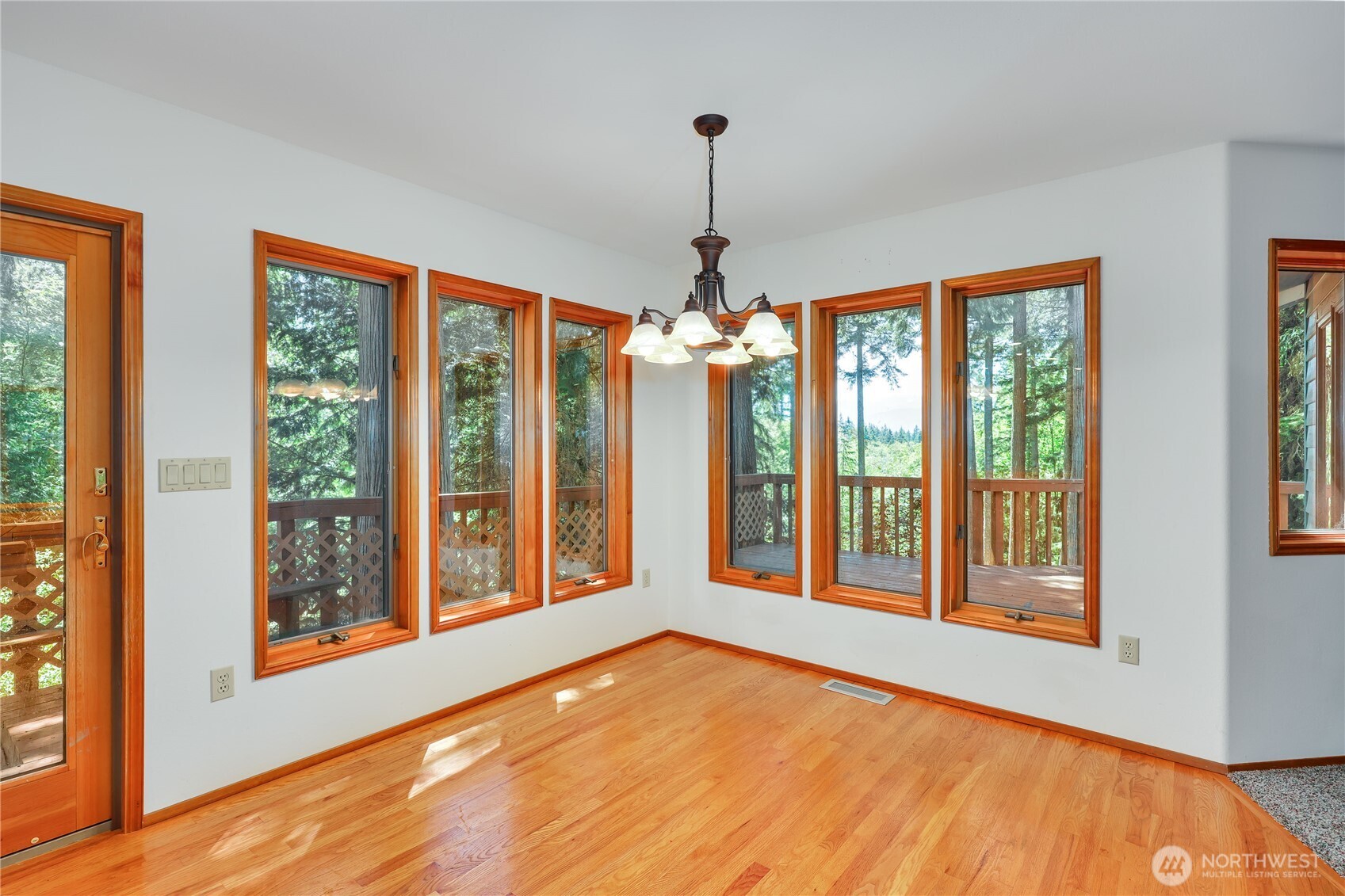 11 Bishop Hill Road Chimacum, WA 98325 - Photo 10 of 34 a view of an empty room with windows and refrigerator